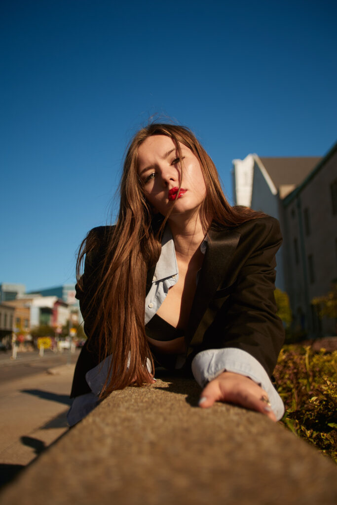 Fashion model in black blazer on Detroit street, outdoor editorial photography by Motor City Moda