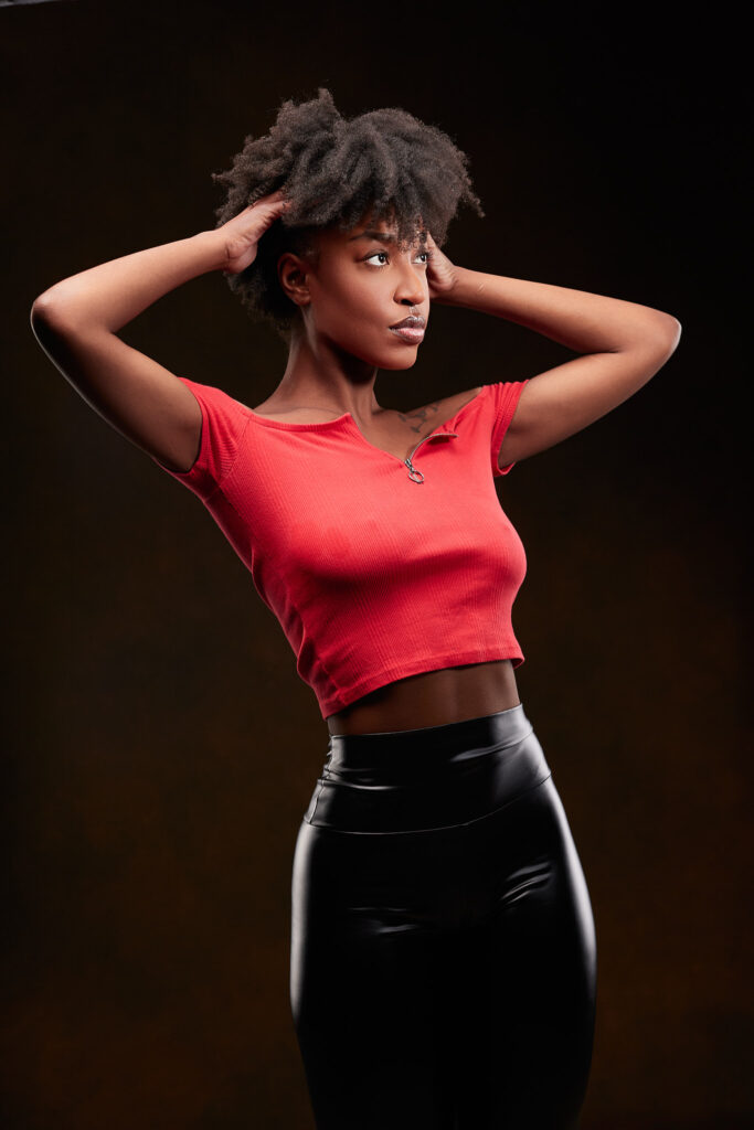 Model in red crop top and black latex skirt, studio fashion photography Detroit by Motor City Moda