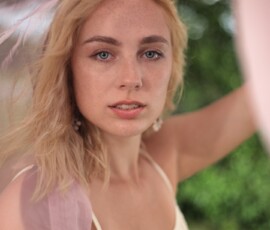 Creative Outdoor Fashion Portrait — Rotary Park Livonia Michigan Close up creative fashion portrait of woman in white lace dress framed through pink flowing fabric at Rotary Park Livonia Michigan