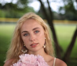 Golden Hour Outdoor Fashion Portrait with Flowers — Livonia Michigan Soft focus fashion portrait of woman in white lace dress holding pink chrysanthemum bouquet at Rotary Park Livonia Michigan