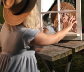 Creative Vintage Mirror Outdoor Fashion Portrait — Livonia Michigan Creative fashion portrait of woman in straw hat touching vintage window mirror on picnic table at Rotary Park Livonia Michigan
