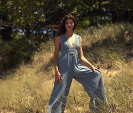 P.J. Hoffmaster State Park Fashion Photography — Muskegon, Michigan Fashion portrait of woman in blue wide-leg jumpsuit posing on sand dunes among trees at Hoffmaster State Park Muskegon Michigan
