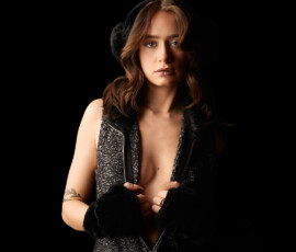 Detroit Metro Michigan Dark Glamour Studio Fashion Photography — Charcoal Boucle Zip Dress Open Neckline Direct Gaze Dark glamour studio fashion portrait woman charcoal boucle zip dress open chest neckline fingerless gloves fluffy headband botanical tattoo nose stud direct gaze one-sided dramatic studio lighting Detroit Metro Michigan